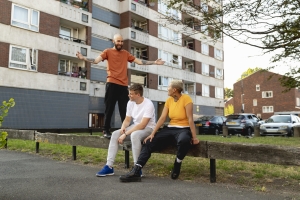 full-shot-friends-sitting-together-suburbs